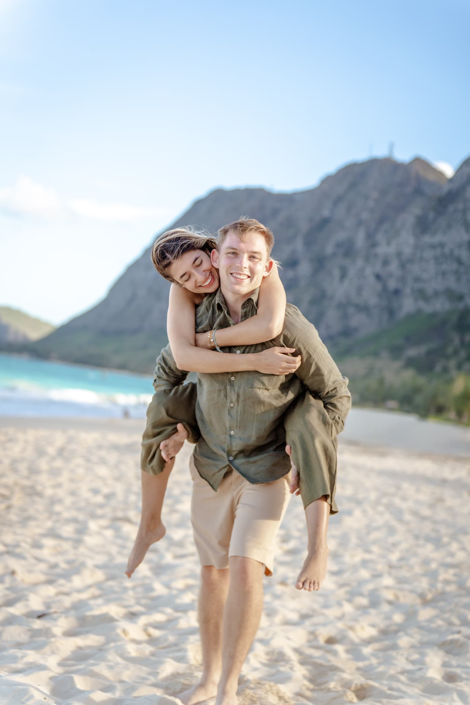 Piggyback ride on the sand — Hawaii, December 2025