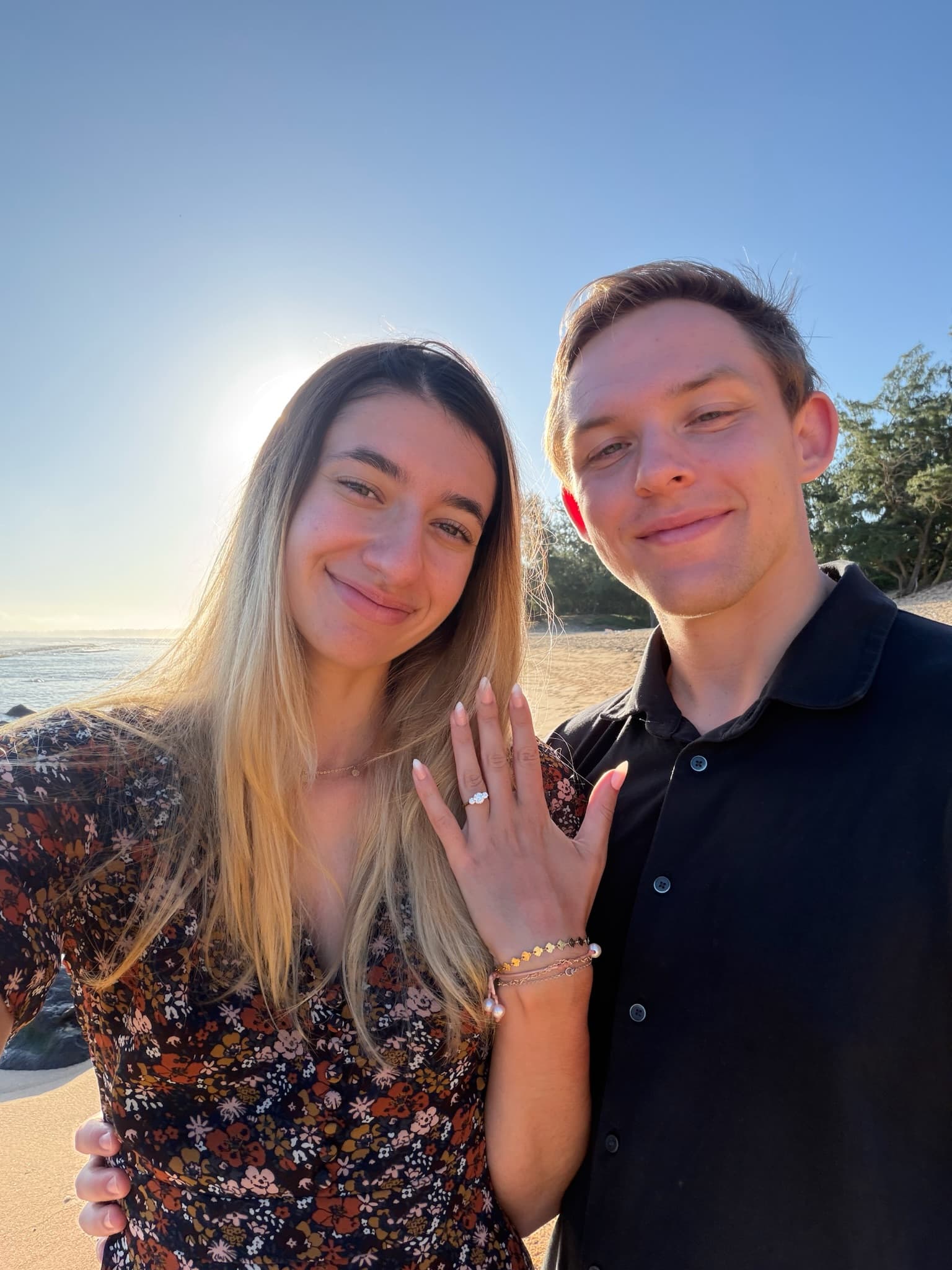 Just-engaged selfie, all smiles — Hawaii, April 2026