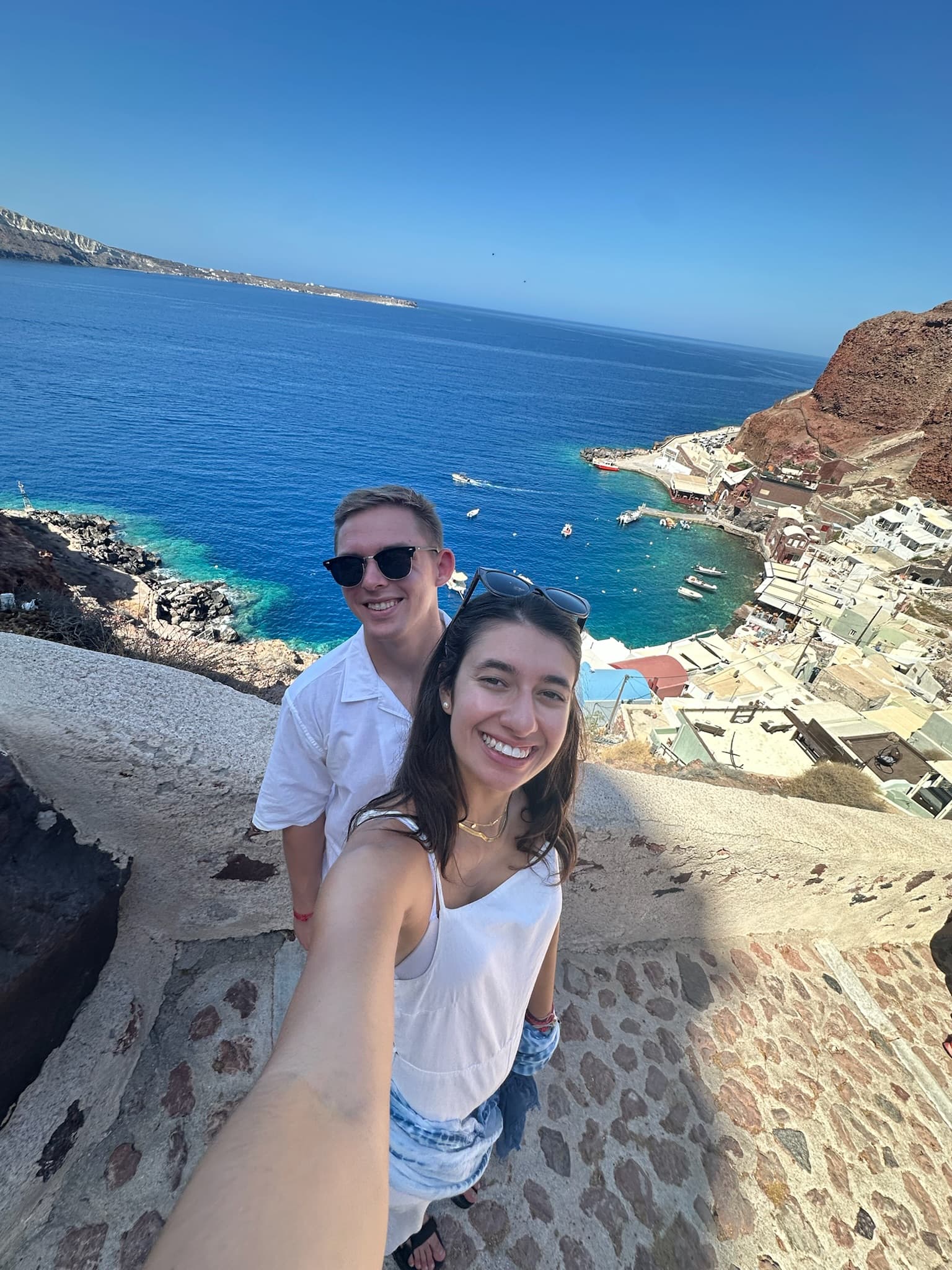 Selfie with the Santorini caldera behind — September 2025